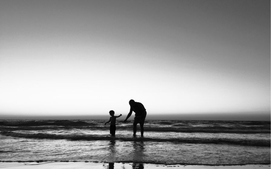 father-and-sun-walking-in-the-sea